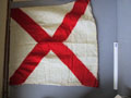 Witte seinvlag met diagonaal een rood kruis